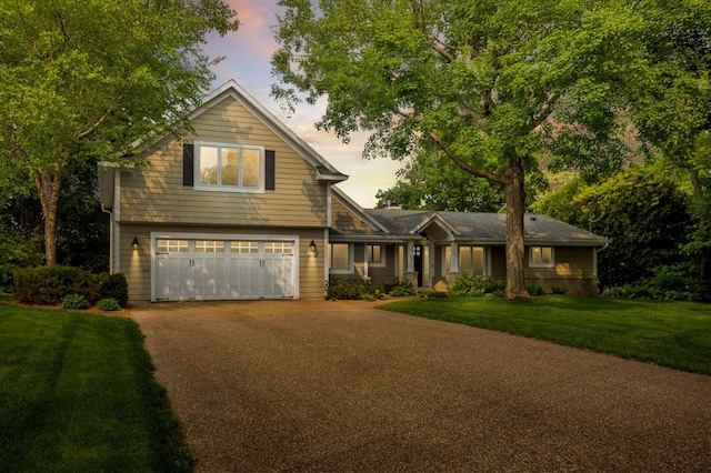 1310 Vine Pl, Orono, MN 55364 - view of front facade featuring driveway, a garage, and a front yard