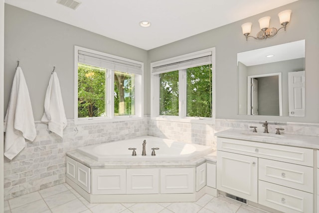 1310 Vine Pl, Orono, MN 55364 - bathroom with vanity, a bath, tile walls, and recessed lighting