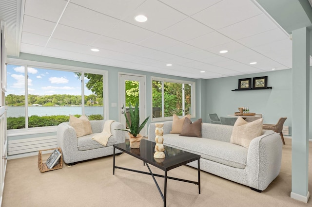 1310 Vine Pl, Orono, MN 55364 - carpeted living room with healthy amount of natural light, a water view, and recessed lighting