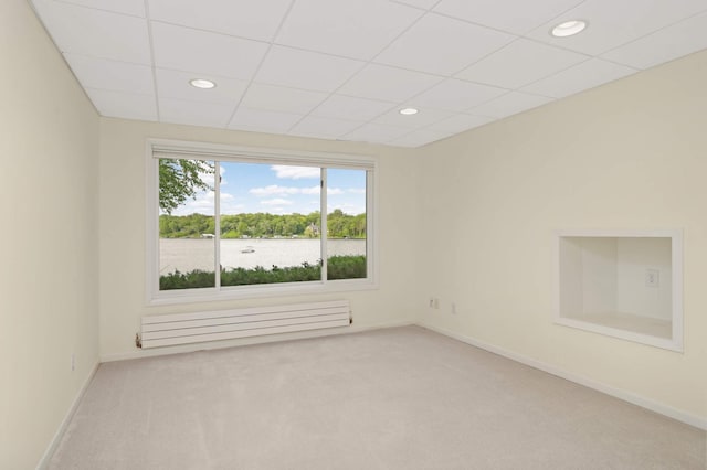 1310 Vine Pl, Orono, MN 55364 - carpeted empty room featuring radiator, baseboards, recessed lighting, and a paneled ceiling