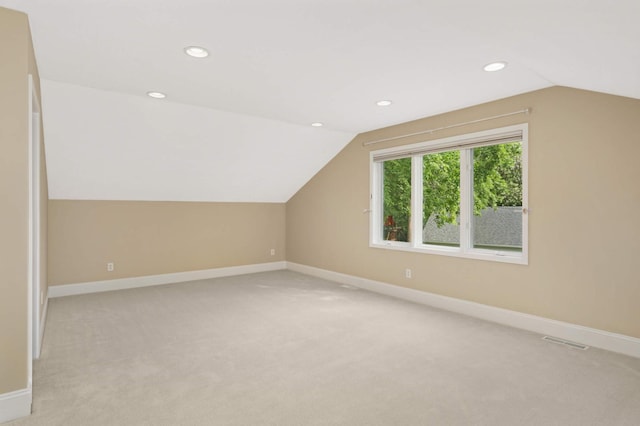 1310 Vine Pl, Orono, MN 55364 - additional living space featuring vaulted ceiling, light colored carpet, recessed lighting, and baseboards