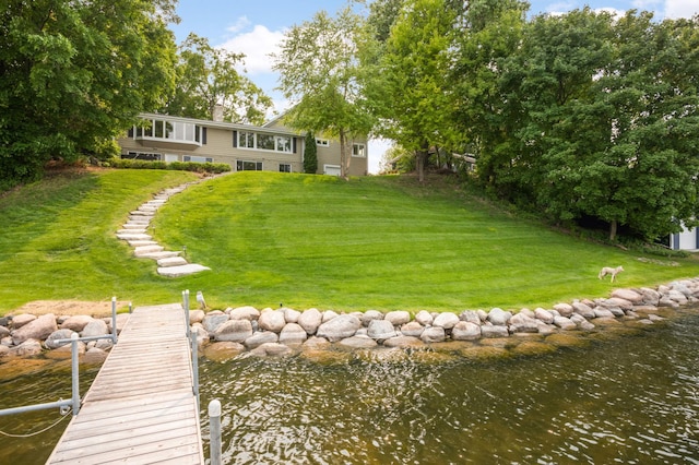 1310 Vine Pl, Orono, MN 55364 - view of green lawn with a boat dock, a water view, and stairway