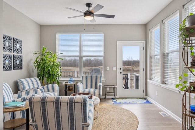 19477 102nd Pl, Corcoran, MN 55374 - living area featuring a ceiling fan and wood finished floors