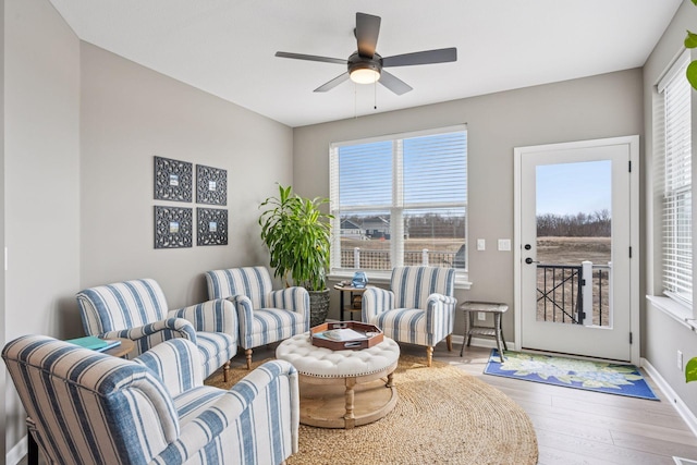 19477 102nd Pl, Corcoran, MN 55374 - living area with a ceiling fan and wood finished floors
