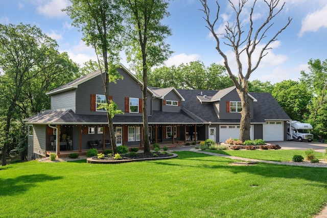 18837 Ogden St NW, Elk River, MN 55330 - view of front of property with covered porch, concrete driveway, and a front yard