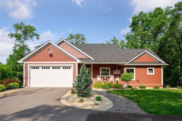 18837 Ogden St NW, Elk River, MN 55330 - craftsman inspired home with asphalt driveway, a porch, a front yard, an attached garage, and roof with shingles