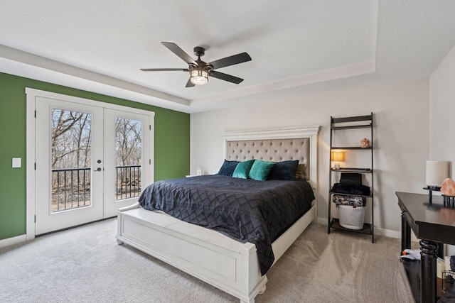 18837 Ogden St NW, Elk River, MN 55330 - carpeted bedroom featuring french doors, access to exterior, baseboards, and a raised ceiling