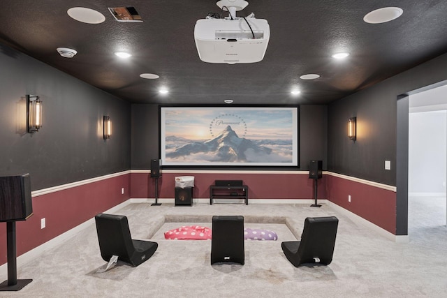18837 Ogden St NW, Elk River, MN 55330 - home theater featuring carpet floors, a textured ceiling, and baseboards
