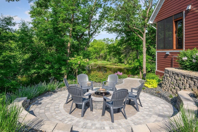 18837 Ogden St NW, Elk River, MN 55330 - view of patio / terrace featuring a fire pit and a water view