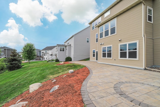 15485 Jersey Ave S, Savage, MN 55378 - rear view of house with a patio, a residential view, and a yard