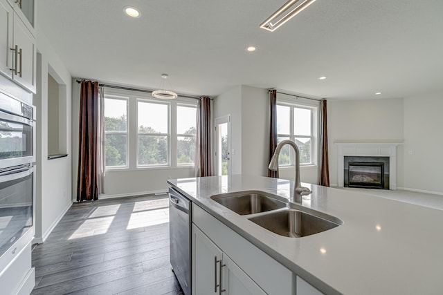 15485 Jersey Ave S, Savage, MN 55378 - kitchen featuring a sink, appliances with stainless steel finishes, healthy amount of natural light, light countertops, and recessed lighting
