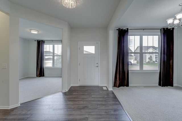 15485 Jersey Ave S, Savage, MN 55378 - foyer entrance with a chandelier, dark wood-style floors, and baseboards