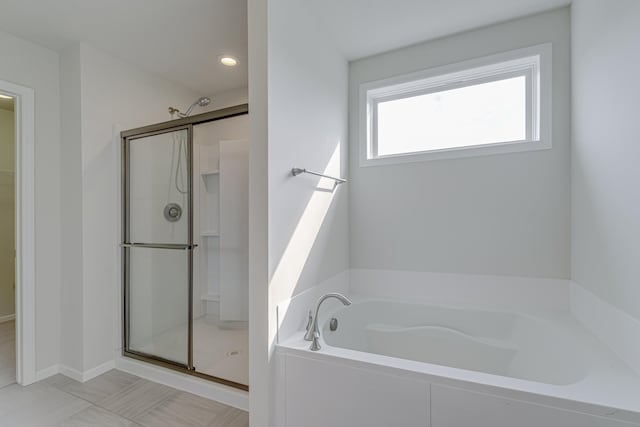 15485 Jersey Ave S, Savage, MN 55378 - bathroom with a stall shower, a garden tub, a spacious closet, and recessed lighting