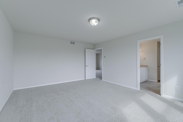 15485 Jersey Ave S, Savage, MN 55378 - unfurnished bedroom with light colored carpet, baseboards, and ensuite bathroom