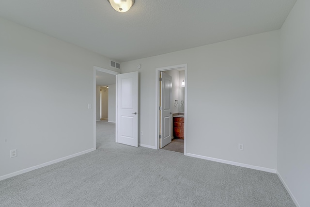 15485 Jersey Ave S, Savage, MN 55378 - unfurnished bedroom with carpet flooring, baseboards, and ensuite bathroom