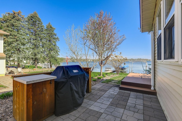 view of patio featuring a wooden deck and area for grilling
