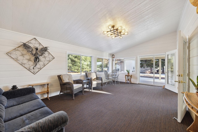 sunroom featuring french doors and a chandelier