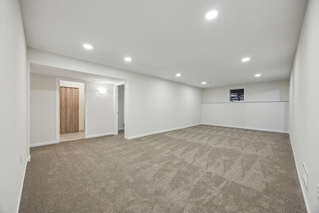 finished below grade area with recessed lighting, carpet, and baseboards