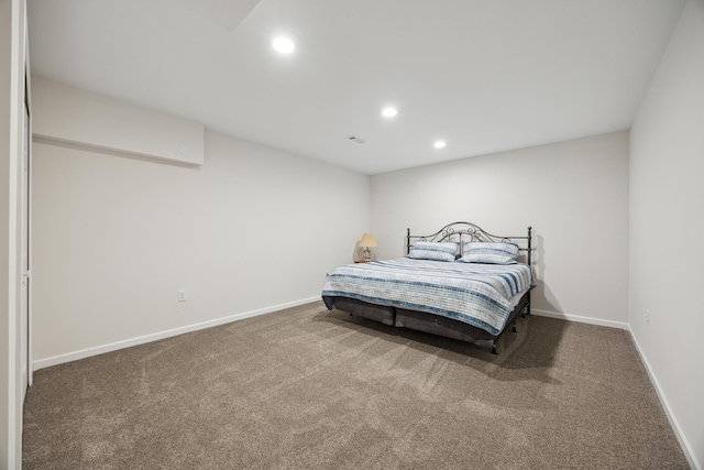 carpeted bedroom featuring recessed lighting, visible vents, and baseboards