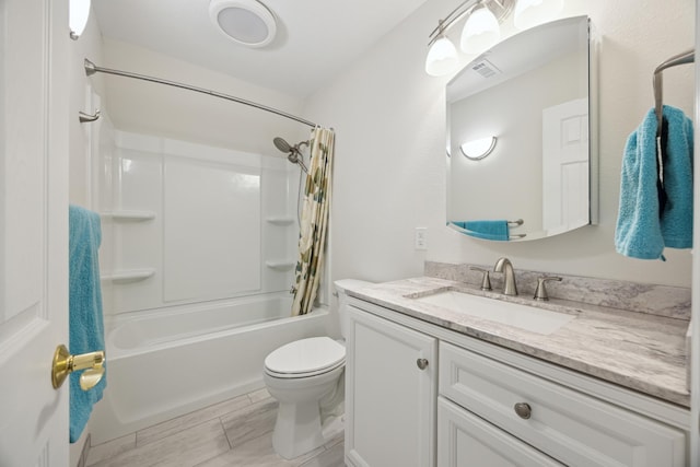 bathroom featuring toilet, vanity, visible vents, and shower / bathtub combination with curtain
