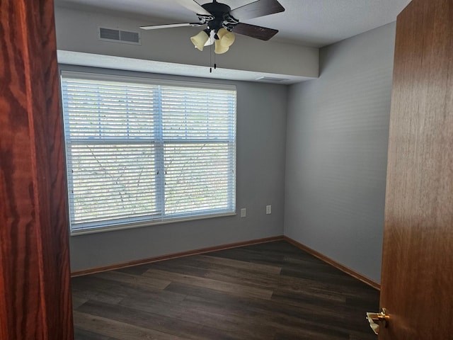 unfurnished room with a ceiling fan, plenty of natural light, and visible vents