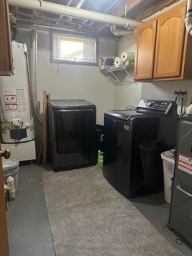 318 Pine Ave S, Sandstone, MN 55072 - washroom featuring washing machine and dryer, water heater, and cabinet space