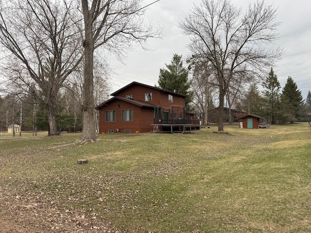 318 Pine Ave S, Sandstone, MN 55072 - exterior space with an outdoor structure, a storage shed, and a deck
