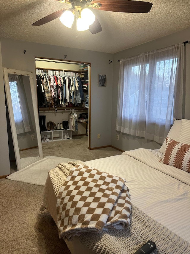 318 Pine Ave S, Sandstone, MN 55072 - bedroom featuring carpet, a closet, baseboards, and ceiling fan