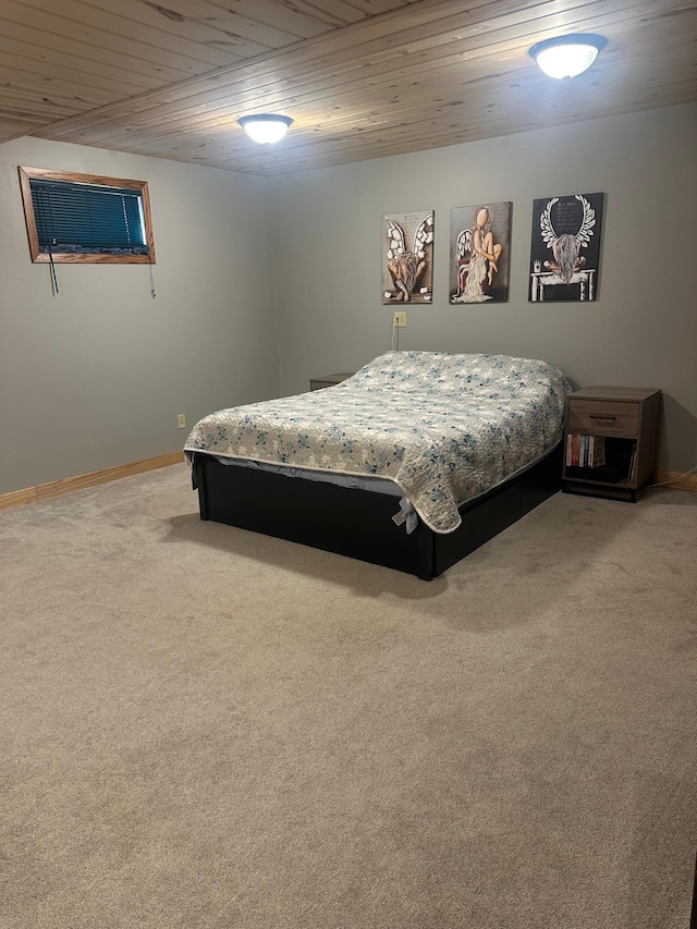 318 Pine Ave S, Sandstone, MN 55072 - carpeted bedroom with wood ceiling and baseboards