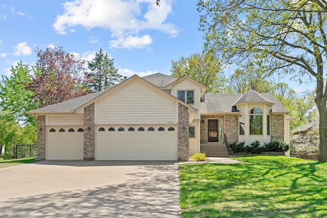 view of front facade featuring brick siding, a garage, driveway, a front lawn, and a shingled roof