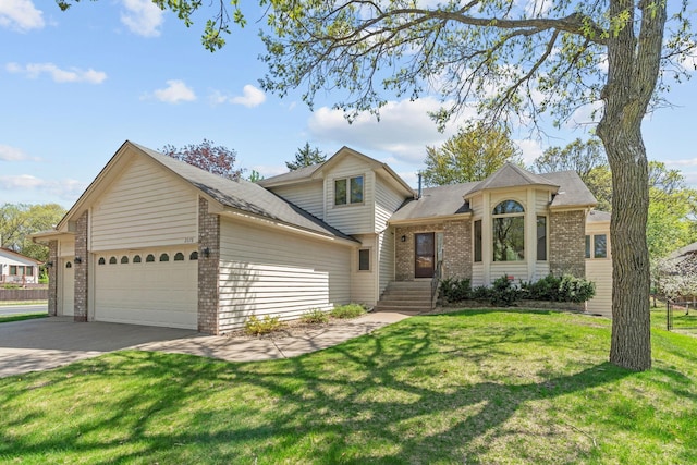view of front of house featuring brick siding, driveway, an attached garage, a front lawn, and a shingled roof