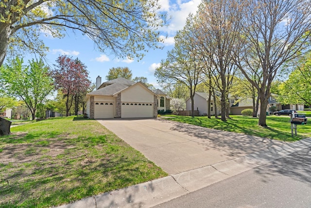 view of front of home featuring a garage, a chimney, a front yard, and concrete driveway