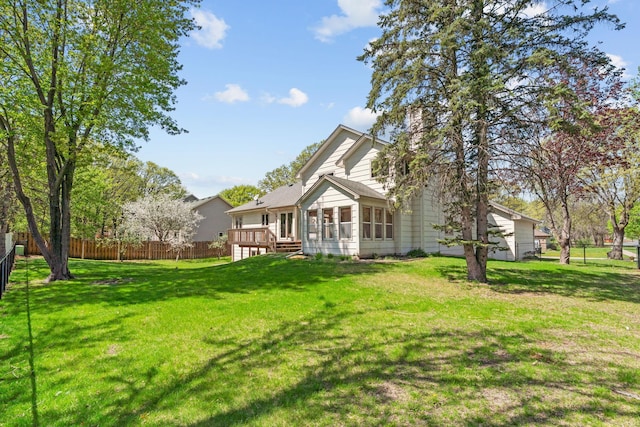 back of property featuring a deck