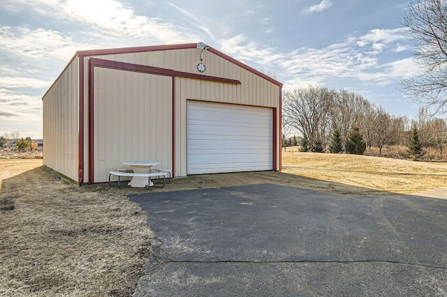 detached garage with aphalt driveway