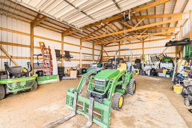 garage featuring metal wall and a garage door opener