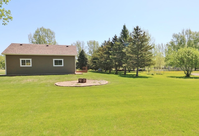 6304 Chickadee Ln SW, Alexandria, MN 56308 - view of green lawn featuring an outdoor fire pit