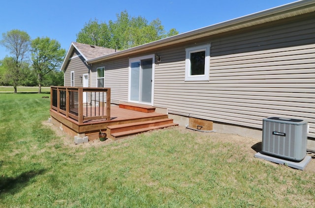 6304 Chickadee Ln SW, Alexandria, MN 56308 - rear view of house with central AC unit, a wooden deck, a yard, and crawl space