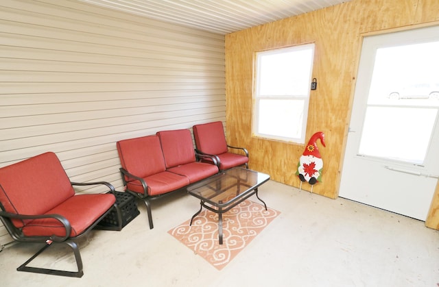 6304 Chickadee Ln SW, Alexandria, MN 56308 - sitting room featuring wooden walls and concrete flooring
