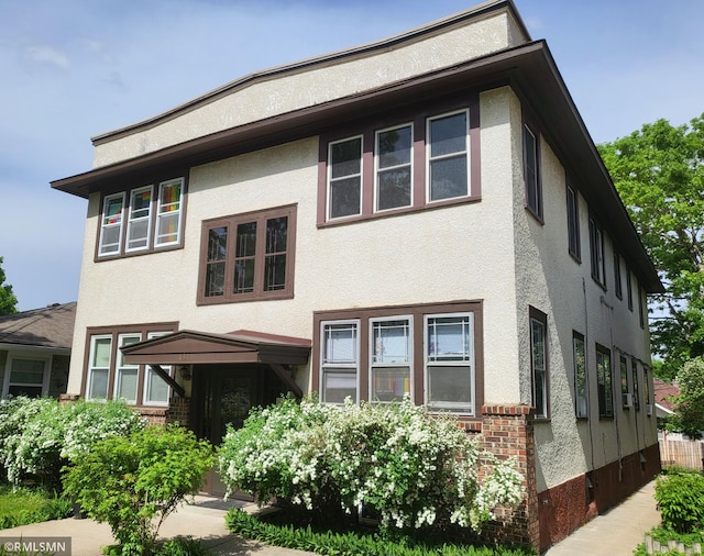 4311 Minnehaha Ave Unit 1, Minneapolis, MN 55406 - view of front of house with stucco siding and brick siding