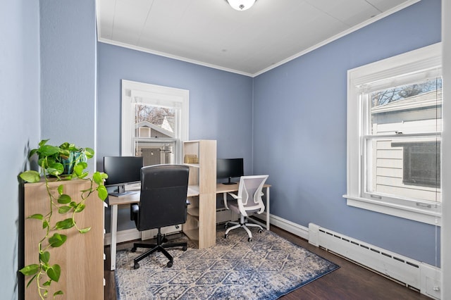 office space with a healthy amount of sunlight, ornamental molding, baseboard heating, and wood finished floors