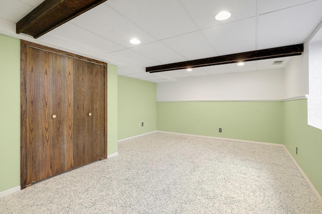 finished below grade area featuring recessed lighting, baseboards, and visible vents