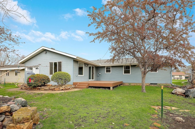 back of house featuring a yard and a deck