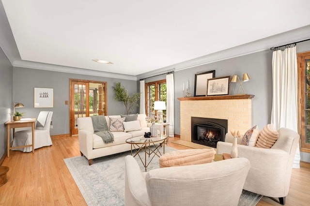 5352 15th Ave S, Minneapolis, MN 55417 - living area with plenty of natural light, light wood finished floors, and a brick fireplace
