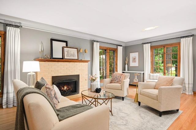 5352 15th Ave S, Minneapolis, MN 55417 - living room with plenty of natural light, wood finished floors, and a brick fireplace