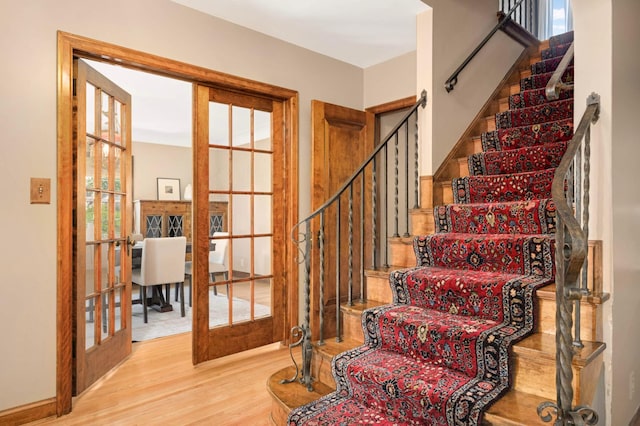5352 15th Ave S, Minneapolis, MN 55417 - staircase with french doors and wood finished floors