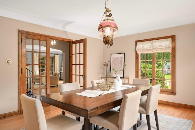 5352 15th Ave S, Minneapolis, MN 55417 - dining room with a chandelier and light wood-type flooring