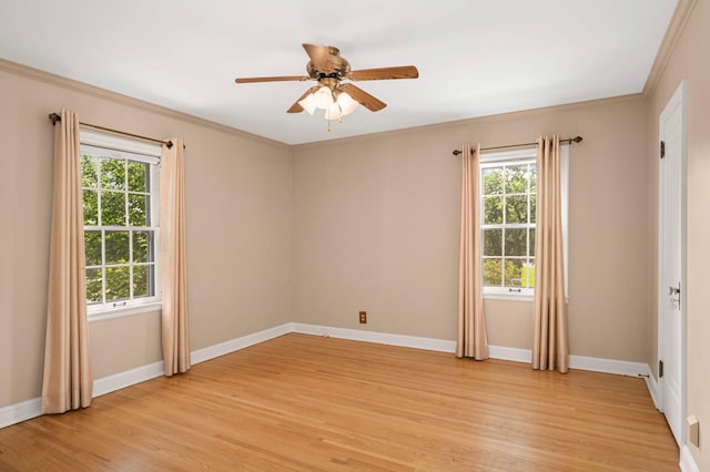 5352 15th Ave S, Minneapolis, MN 55417 - unfurnished room featuring plenty of natural light, light wood-style floors, a ceiling fan, and crown molding
