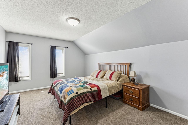bedroom with baseboards, carpet flooring, a textured ceiling, and vaulted ceiling