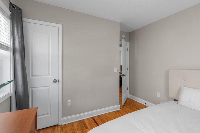 1332 Jersey Ave S, Saint Louis Park, MN 55426 - bedroom with baseboards and wood finished floors