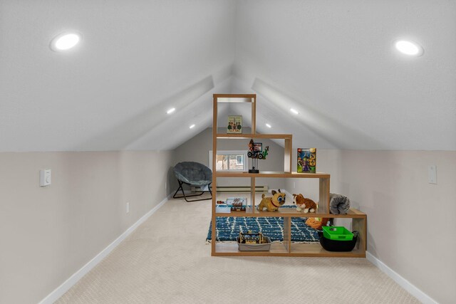 1332 Jersey Ave S, Saint Louis Park, MN 55426 - recreation room with vaulted ceiling, carpet flooring, and baseboards